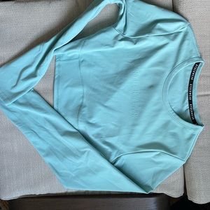 Ryderwear long sleeve crop top. Medium. New without tags